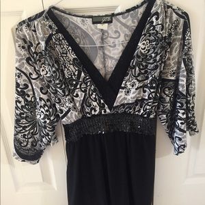 JTB black and white, v-neck, tie back blouse.